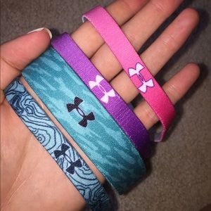 Four Under armour head bands